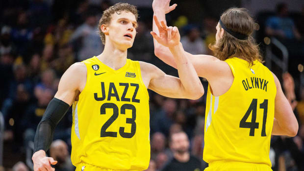 Jazz forward Lauri Markkanen celebrates a made basket with forward Kelly Olynyk.
